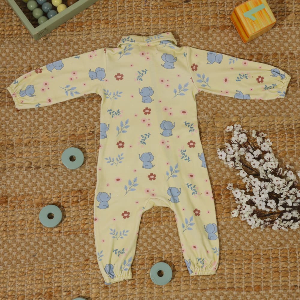 Baby bodysuit with elephant Tusker print, snap closures at bottom.